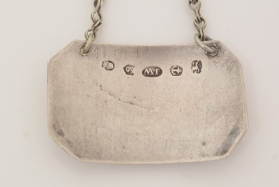 Lot 231 - A George III silver wine label; and another.