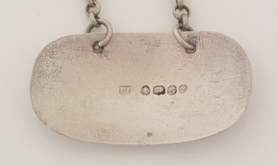 Lot 231 - A George III silver wine label; and another.