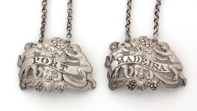 Lot 276 - A pair of George III silver wine labels.