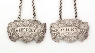 Lot 246 - A pair of George IV silver wine labels.