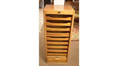 Lot 46 - Attributed to Durrant: a vintage mahogany veneered office stationery cabinet with tambour front.