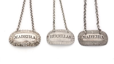 Lot 232 - Three George IV silver wine labels, various.