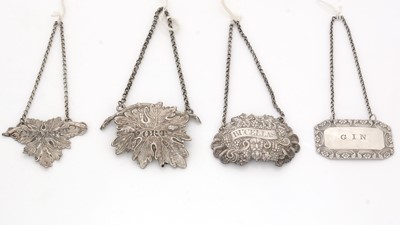Lot 233 - Four various William IV/Victorian silver wine labels.