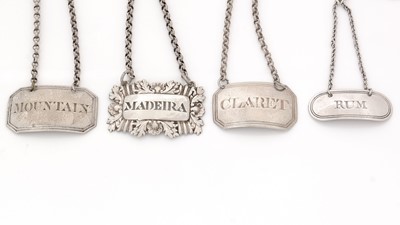 Lot 243 - Four silver Birmingham-made wine labels.