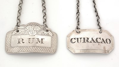 Lot 262 - Two silver wine labels.