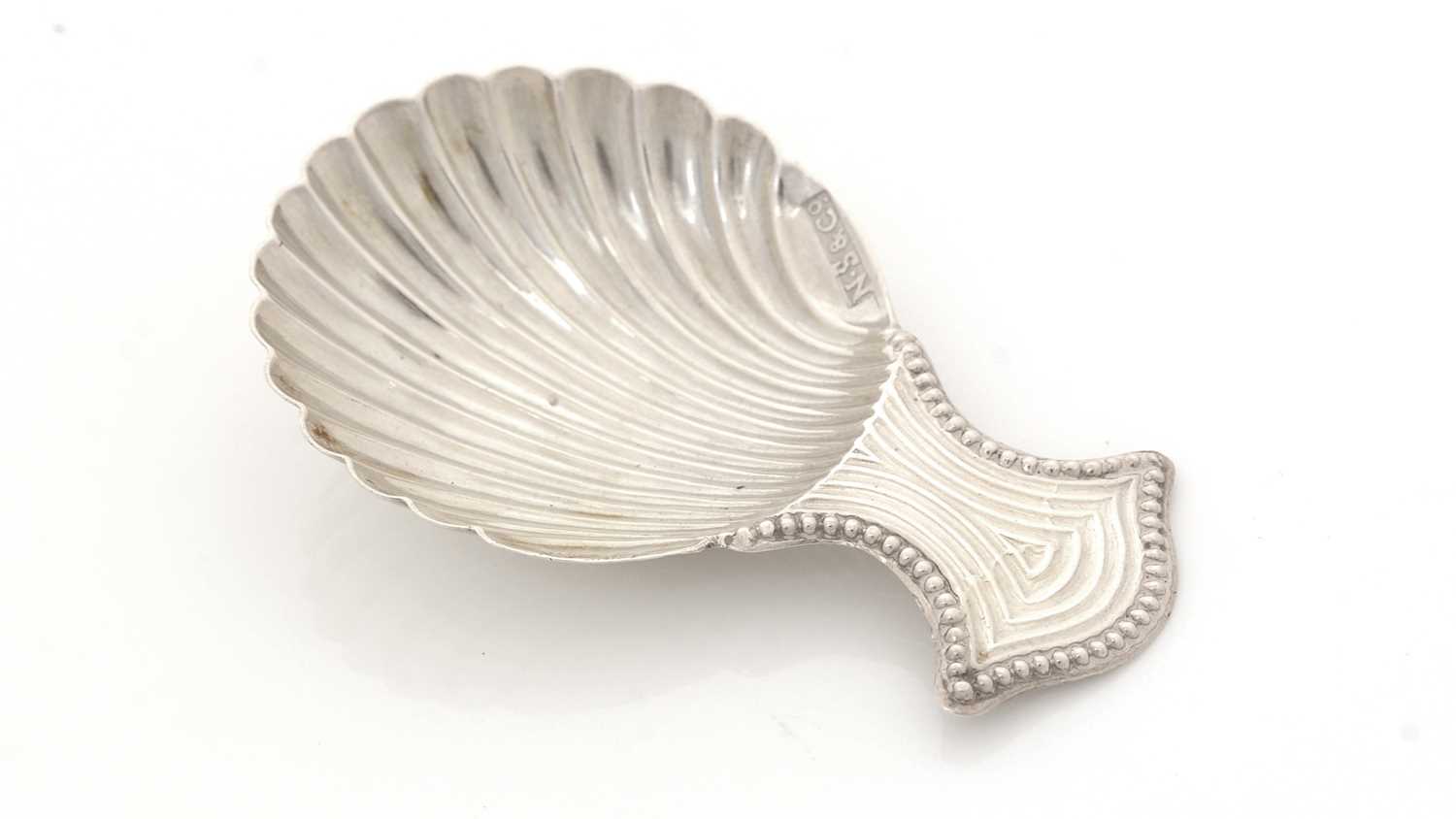 Lot 40 - A George III silver Provincial caddy spoon.