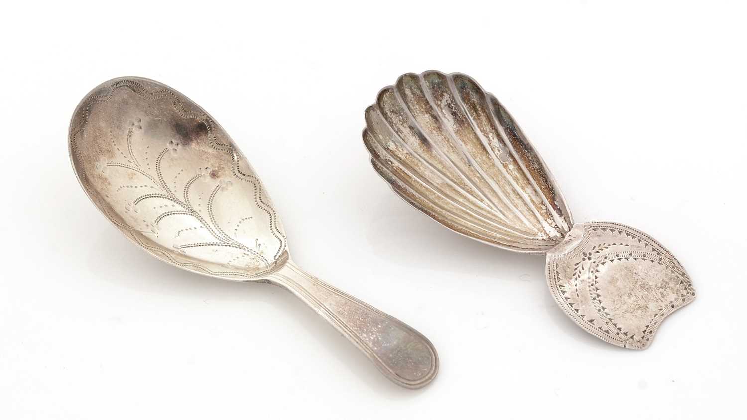 Lot 63 - A George III silver caddy spoon; and another caddy spoon.