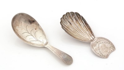 Lot 63 - A George III silver caddy spoon; and another caddy spoon.