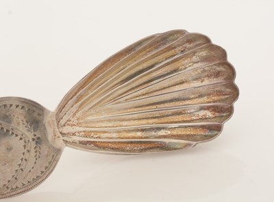 Lot 63 - A George III silver caddy spoon; and another caddy spoon.