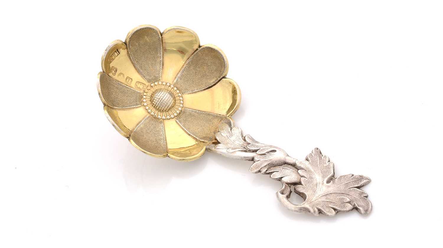 Lot 66 - A Victorian parcel-gilt caddy spoon.