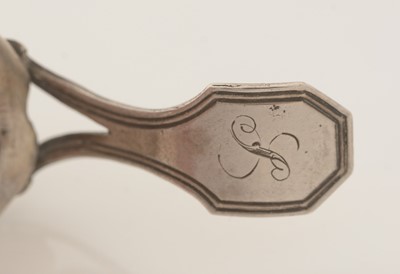 Lot 68 - A George III silver-mounted natural shell caddy spoon.