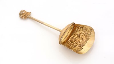 Lot 87 - A late Victorian silver-gilt caddy spoon.