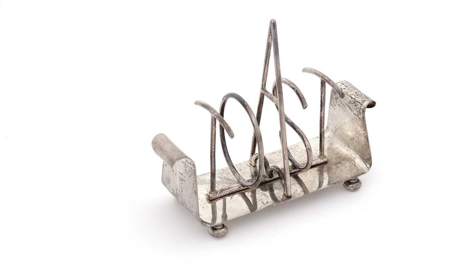 Lot 215 - A late Victorian novelty silver toast rack.