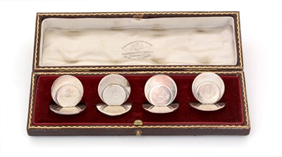 Lot 156 - A George V cased set of four silver menu card holders.