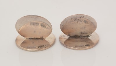 Lot 156 - A George V cased set of four silver menu card holders.