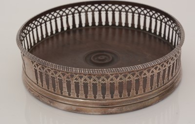 Lot 195 - Two similar George III silver-mounted wine coasters.