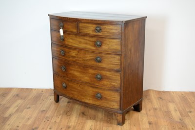 Lot 4 - A George III mahogany and banded bow front chest of drawers