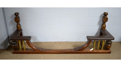 Lot 12 - A substantial vintage oak and brass club fender.