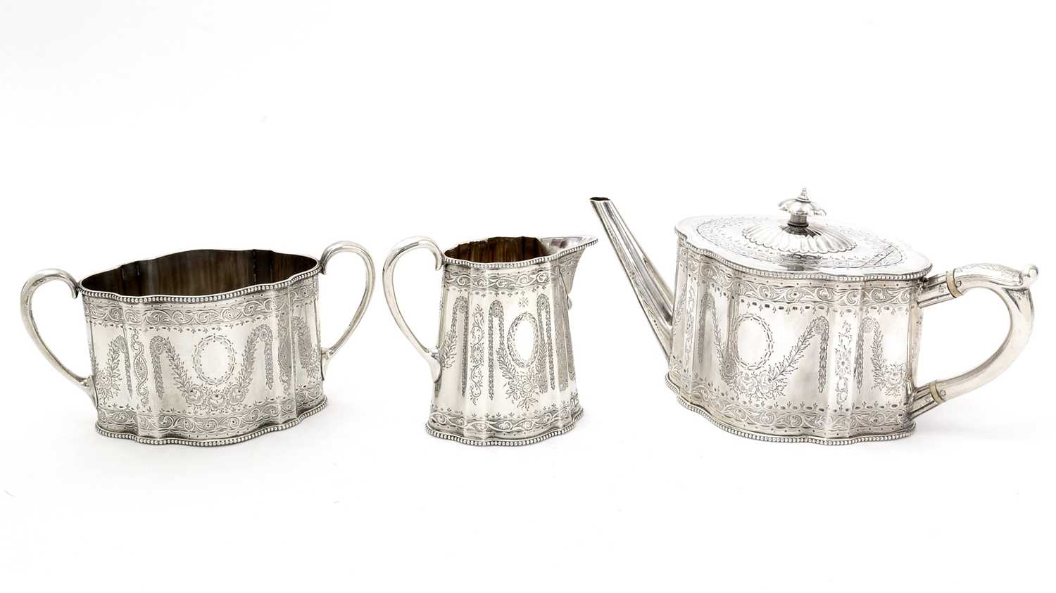Lot 200 - A Victorian silver three-piece tea service.