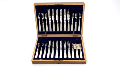 Lot 2 - A George V electroplated cased set of twelve pairs of fruit/dessert knives and forks.