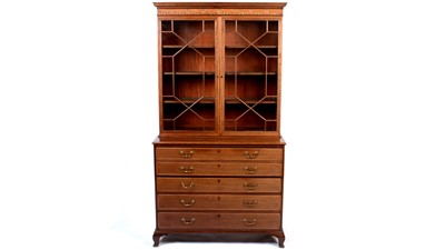 Lot 1109 - A George III fiddle back mahogany and satinwood banded secretaire bookcase