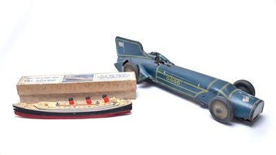 Lot 355 - A Chad Valley ‘Take to Pieces’ model of the RMS Queen Mary; and a Blue Bird’ model racing car.