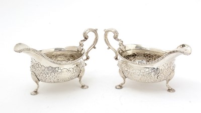 Lot 189 - A matched pair of silver sauceboats.