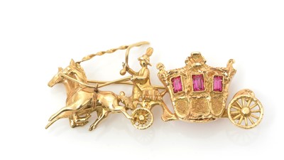 Lot 454 - An 18ct yellow gold and ruby brooch, in the form of a horse-drawn carriage