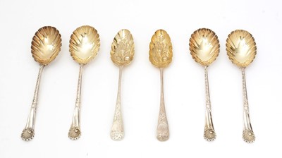 Lot 7 - A set of four late Victorian silver fruit serving spoons; and a pair of silver berry tablespoons.