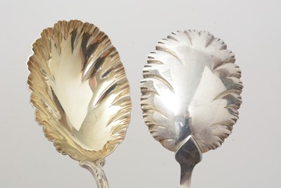 Lot 7 - A set of four late Victorian silver fruit serving spoons; and a pair of silver berry tablespoons.