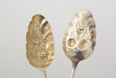 Lot 7 - A set of four late Victorian silver fruit serving spoons; and a pair of silver berry tablespoons.