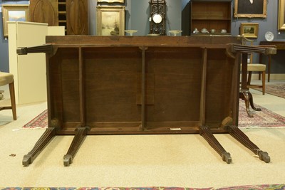 Lot 1112 - Manner of Mayhew & Ince: a George III mahogany and feather banded serving table.