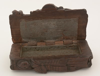 Lot 338 - A late Victorian Scottish carved wooden "blind man" snuff box