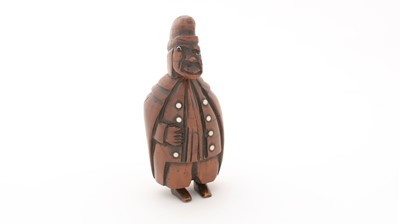 Lot 369 - A 19th Century Continental carved coquilla nut snuff box.