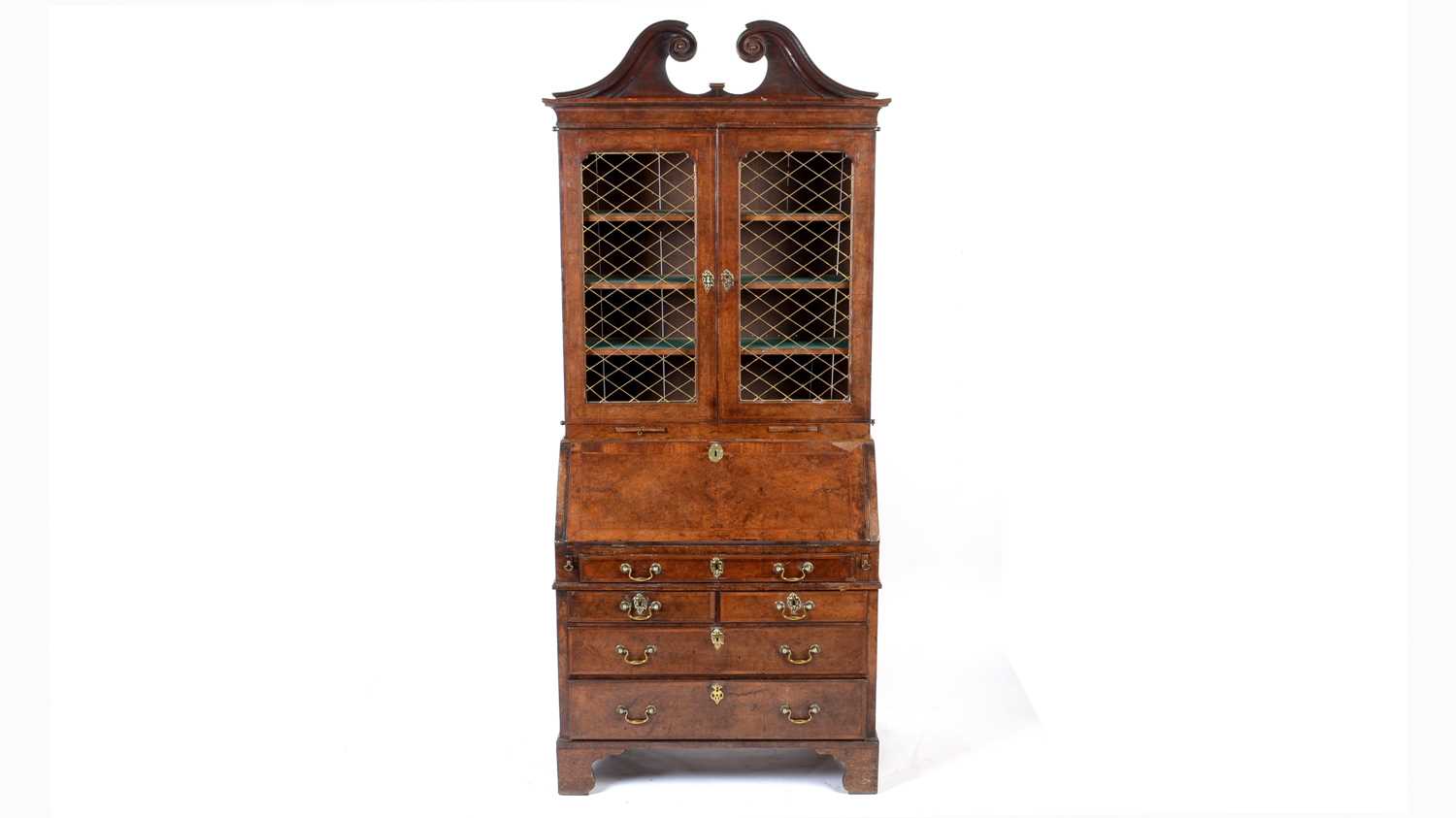 Lot 1115 - A Queen Anne walnut bureau bookcase.