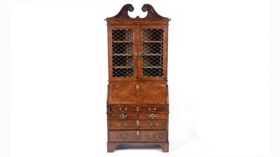 Lot 1115 - A Queen Anne walnut bureau bookcase.