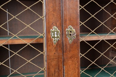 Lot 1115 - A Queen Anne walnut bureau bookcase.