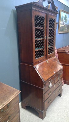 Lot 1115 - A Queen Anne walnut bureau bookcase.