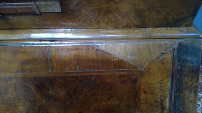 Lot 1115 - A Queen Anne walnut bureau bookcase.
