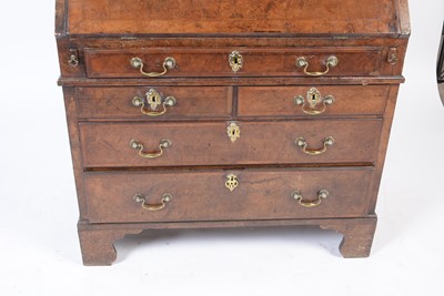 Lot 1115 - A Queen Anne walnut bureau bookcase.