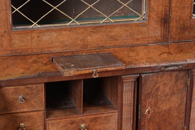 Lot 1115 - A Queen Anne walnut bureau bookcase.