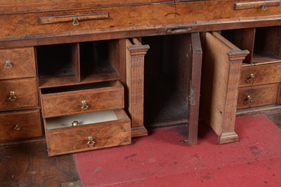 Lot 1115 - A Queen Anne walnut bureau bookcase.