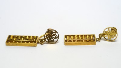 Lot 133 - A pair of Chinese 14ct yellow gold abacus pattern drop earrings