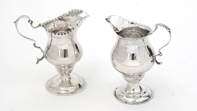 Lot 132 - A George III silver cream jug; and another.