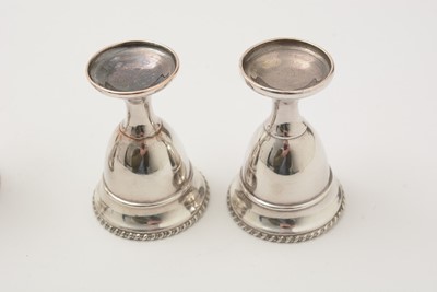 Lot 162 - A George III silver egg frame, four later egg spoons and four plated egg cups.