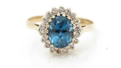 Lot 515 - A topaz and diamond cluster ring
