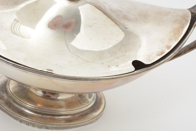 Lot 205 - A pair of George III silver sauce tureens and covers.