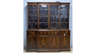 Lot 103 - Frederick Tibbenham Ltd., Ipswich: a Georgian-style repro breakfront bookcase.