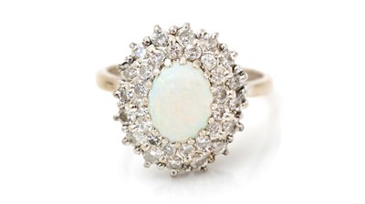 Lot 521 - An opal and diamond cluster ring