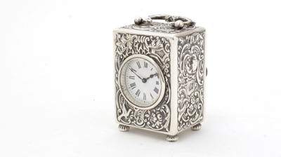 Lot 402 - An Edwardian silver boudoir timepiece.